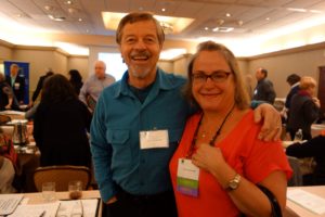 A Man and a Women Posing in a Conference