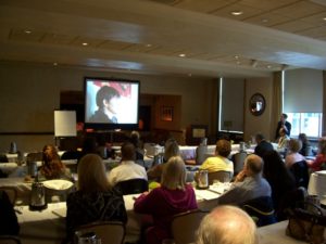 A Group of People Looking at a Projector Screen