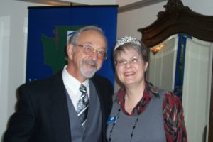 A Man in a Suit With a Woman in a Crown