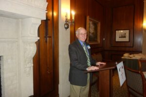 A Man Standing Behind a Podium to Speak