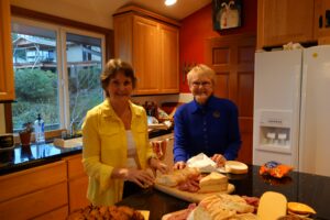 Two Women Standing by a Kitchen Island