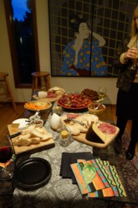 A Wooden Table With Bread and Salad Bowls