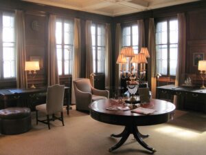 A Round Wooden Table in the Middle of the Room