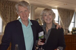 A Man and a Woman Holding a Glass of Wine