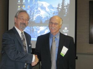 Two Men Shaking Hands With Each Other