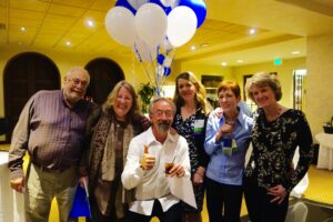 A Group of Elders Standing With Balloons