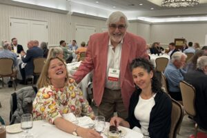 Jon Gould visiting with two conference participants during lunch